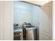 Laundry closet with washer, dryer, and overhead shelving at 10411 Truckee St # A, Commerce City, CO 80022