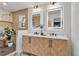 Modern bathroom with double sinks and updated fixtures at 6185 W Frost Dr, Littleton, CO 80128