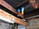 Basement ceiling with exposed pipes and water filters at 427 Idaho St, Idaho Springs, CO 80452