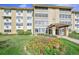 Exterior view of a 3-story apartment building with landscaping at 660 S Alton Way # 7A, Denver, CO 80247