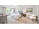 Bedroom with window, chair, and bedside tables at 660 S Alton Way # 7A, Denver, CO 80247