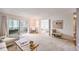 Living room with access to patio and view of bedroom at 660 S Alton Way # 7A, Denver, CO 80247