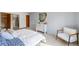 Bedroom with dresser, comfortable chair and en-suite bathroom at 660 S Alton Way # 7A, Denver, CO 80247
