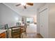 Dining area with table and chairs, view into living room at 660 S Alton Way # 7A, Denver, CO 80247