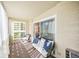 Bright sunroom with comfy seating and sliding glass doors at 660 S Alton Way # 7A, Denver, CO 80247