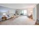 Bright living room with sliding door to patio, neutral decor, and ample natural light at 660 S Alton Way # 7A, Denver, CO 80247