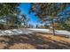 Snow covered backyard with trees and view at 6101 S University Blvd, Centennial, CO 80121