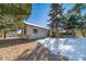 House backyard view with deck and trees at 6101 S University Blvd, Centennial, CO 80121
