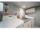 Clean basement laundry room with washer, dryer, and utility sink at 6101 S University Blvd, Centennial, CO 80121