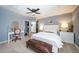 Spacious bedroom with a comfortable bed, vanity, and plenty of natural light at 6101 S University Blvd, Centennial, CO 80121