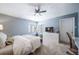 Bright bedroom featuring a comfy bed, large windows, and built-in storage at 6101 S University Blvd, Centennial, CO 80121
