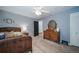 Well-lit bedroom with a wooden frame bed and ample closet space at 6101 S University Blvd, Centennial, CO 80121