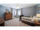 Cozy bedroom with wood floors, ample closet space, and bay window at 6101 S University Blvd, Centennial, CO 80121