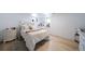 Charming basement bedroom with light flooring and a comfortable bed at 6101 S University Blvd, Centennial, CO 80121
