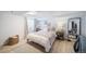 Cozy basement bedroom with a comfortable bed and a full-length mirror at 6101 S University Blvd, Centennial, CO 80121