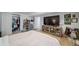 Spacious basement bedroom with large TV, dresser, and walk-in closet at 6101 S University Blvd, Centennial, CO 80121