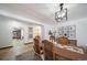 Open dining area with hardwood floors and stylish light fixture at 6101 S University Blvd, Centennial, CO 80121