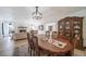 Spacious dining area with hardwood floors and a view into the living room at 6101 S University Blvd, Centennial, CO 80121