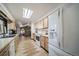 Galley-style kitchen with ample cabinet space and stainless steel appliances at 6101 S University Blvd, Centennial, CO 80121