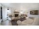 Spacious living room featuring a fireplace, large windows, and comfortable seating at 6101 S University Blvd, Centennial, CO 80121