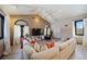 Spacious living room with vaulted ceilings, large sectional sofa, and a modern aesthetic at 6101 S University Blvd, Centennial, CO 80121