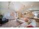 Spacious living room with sectional sofa, decorative rug, and large windows at 6101 S University Blvd, Centennial, CO 80121