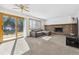 Living room with fireplace and sliding glass door at 5895 S Killarney Way, Centennial, CO 80015