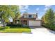 Two-story house with attached garage and lawn at 5895 S Killarney Way, Centennial, CO 80015