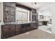 Spacious butlers pantry with ample cabinetry and wine storage at 5895 S Killarney Way, Centennial, CO 80015