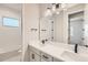 Modern bathroom with double sinks, a bathtub, and a separate shower at 2700 E 102Nd Pl, Denver, CO 80229