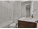 Clean bathroom with shower/tub combo, vanity with double sinks, and updated fixtures at 30 S Oneida St, Denver, CO 80230
