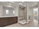 Spa-like bathroom with a large walk-in shower and double vanity at 30 S Oneida St, Denver, CO 80230