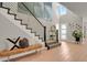 Bright and spacious entryway with hardwood floors and modern staircase at 30 S Oneida St, Denver, CO 80230