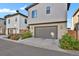 Modern townhome with attached garage and landscaped grounds at 30 S Oneida St, Denver, CO 80230