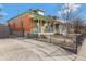 Side view of the brick home highlighting the green accents at 756 Kalamath St, Denver, CO 80204