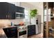 Modern kitchen with stainless steel appliances and dark cabinetry at 3232 Arapahoe St, Denver, CO 80205