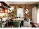 Cozy living room featuring an exposed brick wall and comfortable seating at 3232 Arapahoe St, Denver, CO 80205