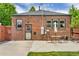Brick home with a spacious backyard patio, perfect for outdoor dining at 1454 Rosemary St, Denver, CO 80220