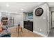 Finished basement with sitting area and mini fridge at 1454 Rosemary St, Denver, CO 80220