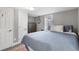 Spacious bedroom with a queen-size bed, ample closet space, and neutral decor at 1454 Rosemary St, Denver, CO 80220