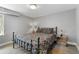 Cozy bedroom with a full-size bed and nightstands, offering a peaceful retreat at 1454 Rosemary St, Denver, CO 80220