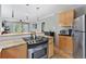 Kitchen with stainless steel appliances and granite counters at 1454 Rosemary St, Denver, CO 80220