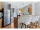 Stainless steel appliances and kitchen island at 1454 Rosemary St, Denver, CO 80220