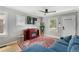 Living room with fireplace and blue sectional sofa at 1454 Rosemary St, Denver, CO 80220