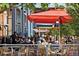 Bustling outdoor patio with colorful umbrellas at 1454 Rosemary St, Denver, CO 80220