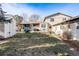 Landscaped backyard with hot tub, patio, and storage shed at 3408 S Kittredge St, Aurora, CO 80013