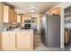 Kitchen with light wood cabinets and stainless steel appliances at 3408 S Kittredge St, Aurora, CO 80013