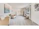 Bright living room with two armchairs and a built-in shelf at 3408 S Kittredge St, Aurora, CO 80013