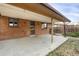 Brick patio with covered area and access to backyard at 1540 S Kendall St, Lakewood, CO 80232