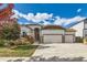 House exterior with two-car garage and landscaping at 6803 Ponderosa St, Frederick, CO 80530